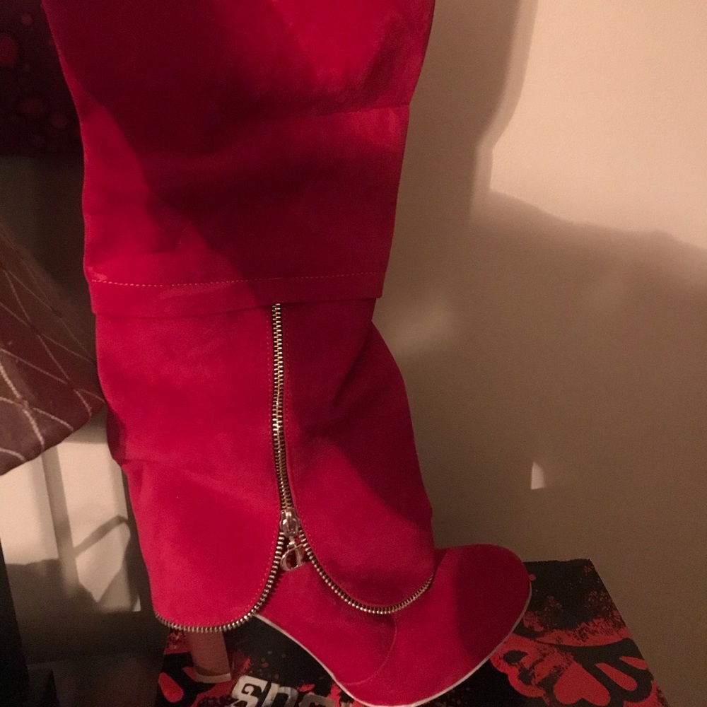 Red suede like boots. Never worn!